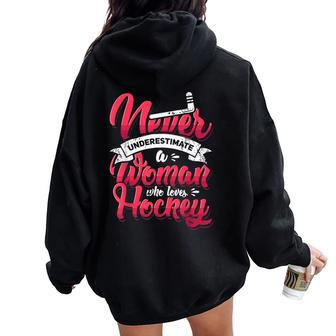 Never Underestimate A Woman Who Loves Hockey Ice Hockey Women Oversized Hoodie Back Print | Mazezy