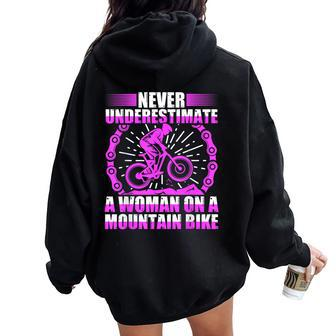 Never Underestimate A Woman On A Mountain Bike Women Oversized Hoodie Back Print - Monsterry