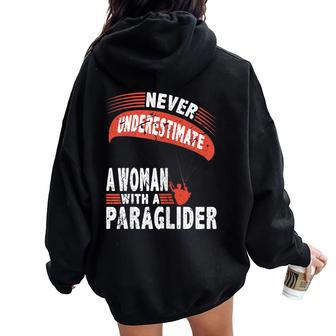 Never Underestimate Woman Paraglider Parachute Women Oversized Hoodie Back Print - Monsterry