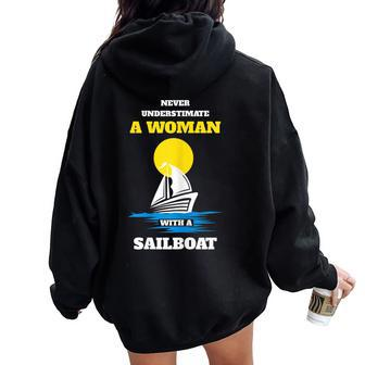 Never Underestimate A Woman With A Sailboat Women Oversized Hoodie Back Print - Seseable