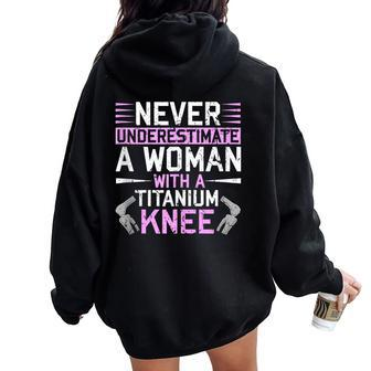 Never Underestimate A Woman With A Titanium Knee Replacement Women Oversized Hoodie Back Print - Monsterry AU