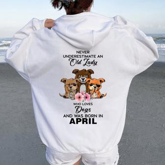 April Never Underestimate An Old Lady Who Loves Dogs Women Oversized Hoodie Back Print | Mazezy
