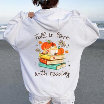 Fall In Love With Reading Book Autumn Pumpkins And Teachers Women Oversized Hoodie Back Print - Monsterry DE