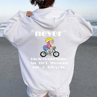 Never Underestimate An Old Lady On A Bicycle Women Oversized Hoodie Back Print - Seseable