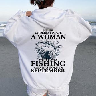 Never Underestimate Awoman Who Loves Fishing -September Women Oversized Hoodie Back Print - Thegiftio UK