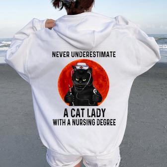 Never Underestimate A Cat Lady With A Nursing Degree Women Oversized Hoodie Back Print - Monsterry