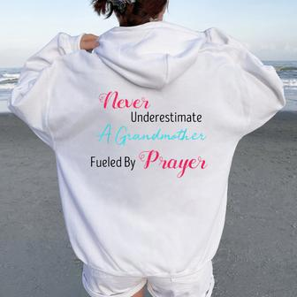 Never Underestimate A Grandmother Fueled By Prayer Women Oversized Hoodie Back Print - Seseable