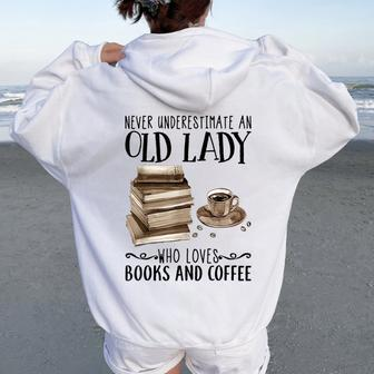 Never Underestimate An Old Lady Who Loved Books And Coffee Women Oversized Hoodie Back Print | Mazezy