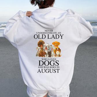 Never Underestimate An Old Lady Who Loves Dogs August Women Oversized Hoodie Back Print | Mazezy
