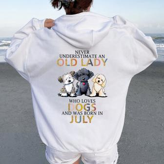 Never Underestimate Old Lady Loves Dogs Born In July Women Oversized Hoodie Back Print - Seseable