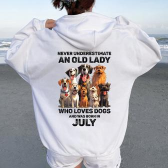 Never Underestimate An Old Lady Who Loves Dogs July Women Oversized Hoodie Back Print - Monsterry CA