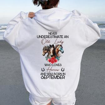 Never Underestimate An Old Lady Who Loves Horses September Women Oversized Hoodie Back Print | Mazezy