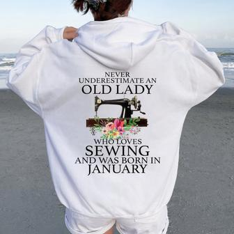 Never Underestimate An Old Lady Who Loves Sewing January Women Oversized Hoodie Back Print - Seseable