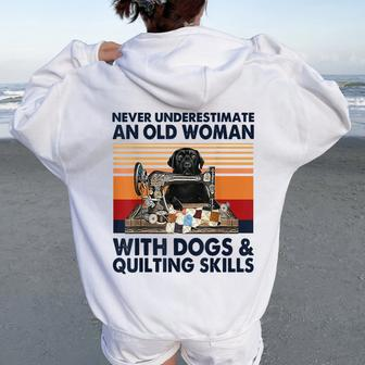 Never Underestimate An Old Woman With Dogs & Quilting Skills Women Oversized Hoodie Back Print | Mazezy CA