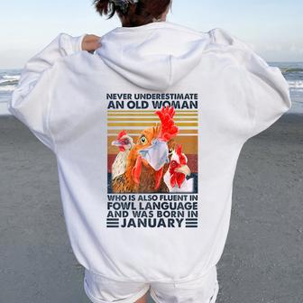 Never Underestimate Old Woman Fluent Fowl Born In January Women Oversized Hoodie Back Print - Seseable