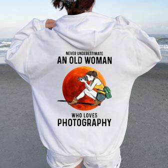 Never Underestimate An Old Woman Who Loves Photography Women Oversized Hoodie Back Print - Thegiftio UK