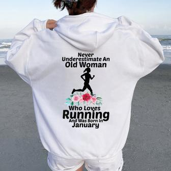 Never Underestimate An Old Woman Who Loves Running January Women Oversized Hoodie Back Print | Mazezy UK