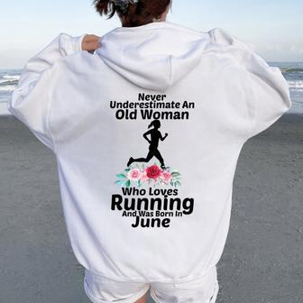Never Underestimate An Old Woman Who Loves Running June Women Oversized Hoodie Back Print | Mazezy