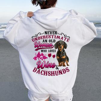 Never Underestimate An Old Woman Who Loves Wine & Dachshunds Women Oversized Hoodie Back Print | Mazezy DE
