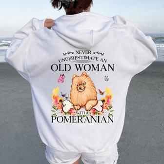 Never Underestimate An Old Woman With A Pomeranian Women Oversized Hoodie Back Print - Monsterry UK