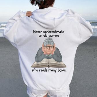 Never Underestimate An Old Woman Who Read Many Book Women Oversized Hoodie Back Print | Mazezy