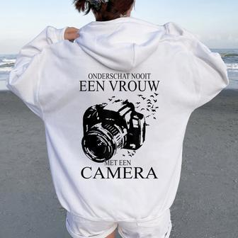 Never Underestimate A Woman With A Camera Dutch Photographer Women Oversized Hoodie Back Print | Mazezy