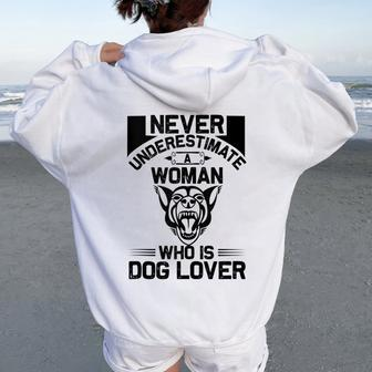 Never Underestimate A Woman Who Is A Dog Lover Dog Women Oversized Hoodie Back Print - Seseable