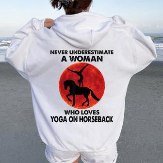Never Underestimate A Woman Who Loves Yoga On Horseback Women Oversized Hoodie Back Print | Mazezy