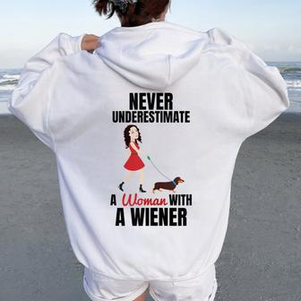 Never Underestimate A Woman With A Wiener Dachshund Women Oversized Hoodie Back Print - Seseable