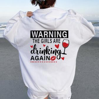 Warning The Girls Are Drinking Again Women Oversized Hoodie Back Print | Mazezy