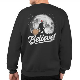 Believe Santa Bigfoot Christmas Snow & Moon Night Graphic Sweatshirt Back Print - Thegiftio UK