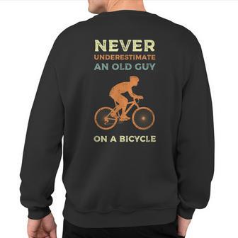 Cyclist Never Underestimate An Old Guy On A Bicycle Vintage Sweatshirt Back Print - Thegiftio UK