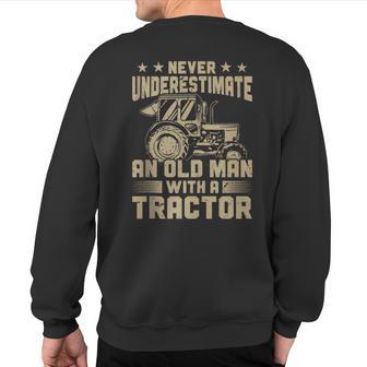 Farmer Never Underestimate And Old Man With A Tractor Sweatshirt Back Print - Thegiftio UK