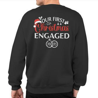 Our First Christmas Engaged 2023 Christmas Couple Matching Sweatshirt Back Print - Thegiftio UK
