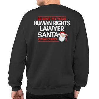 Be Nice To Human Rights Litigation Lawyer Santa Is Watching Sweatshirt Back Print | Mazezy