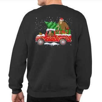 Santa Bigfoot Riding Red Truck & Xmas Tree Merry Christmas Sweatshirt Back Print - Thegiftio UK