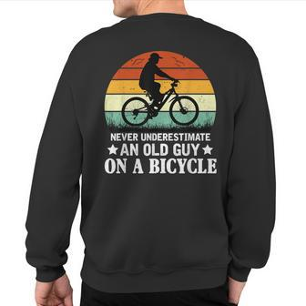 Never Underestimate An Old Guy On A Bicycle Cycling Sunset Sweatshirt Back Print - Monsterry AU