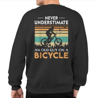 Never Underestimate An Old Guy On A Bicycle Cycling Vintage Sweatshirt Back Print - Seseable