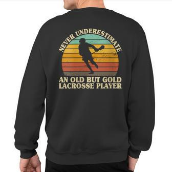 Never Underestimate An Old Lacrosse Player Coach Sweatshirt Back Print - Monsterry AU