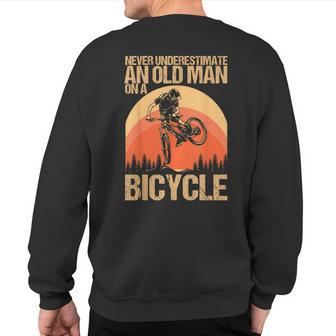 Never Underestimate An Old Man On A Bicycle Cycling Sweatshirt Back Print - Monsterry UK
