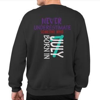Never Underestimate Someone Born In July 7 Sweatshirt Back Print - Thegiftio UK