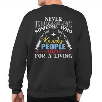 Never Underestimate Someone Who Knocks People Out For Living Sweatshirt Back Print - Thegiftio UK
