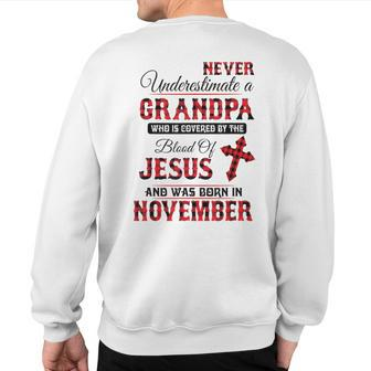 Never Underestimate A November Grandpa The Blood Of Jesus Sweatshirt Back Print - Monsterry DE
