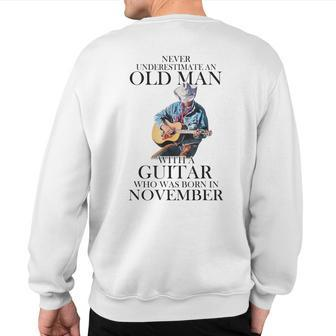 Never Underestimate A November Man With A Guitar Sweatshirt Back Print | Mazezy