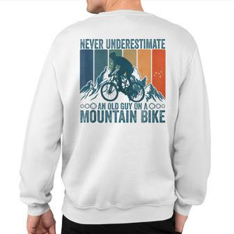 Never Underestimate An Old Guy On A Mountain Bike Cycling Sweatshirt Back Print - Monsterry UK