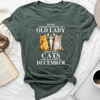 Never Underestimate An Old Lady Who Loves Cats Born December Bella Canvas T-shirt | Mazezy