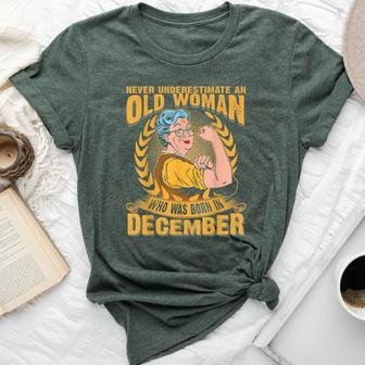 Never Underestimate An Old Woman Who Born In December Bella Canvas T-shirt - Seseable
