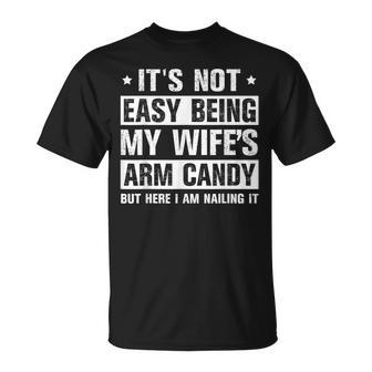 Its Not Easy Being My Wifes Arm Candy Here I Am Nailing It Unisex T-Shirt - Seseable