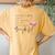 Wrinkles Only Go Where Smiles Have Been Cute Flamingo Women's Oversized Comfort T-Shirt Back Print Mustard