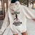 Never Underestimate An Old Woman Who Loves Running January Women Oversized Hoodie Back Print Sand